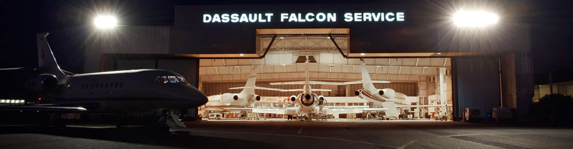 Planes in the hangar at night