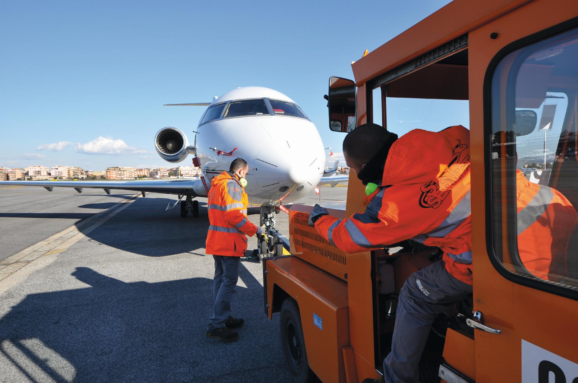 Maintenance staff near the plane