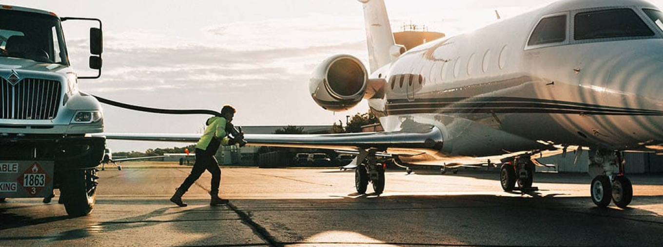 Tank truck, plane and man