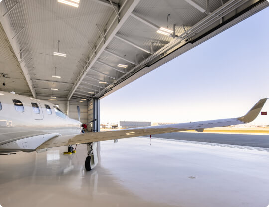 White plane in the hangar