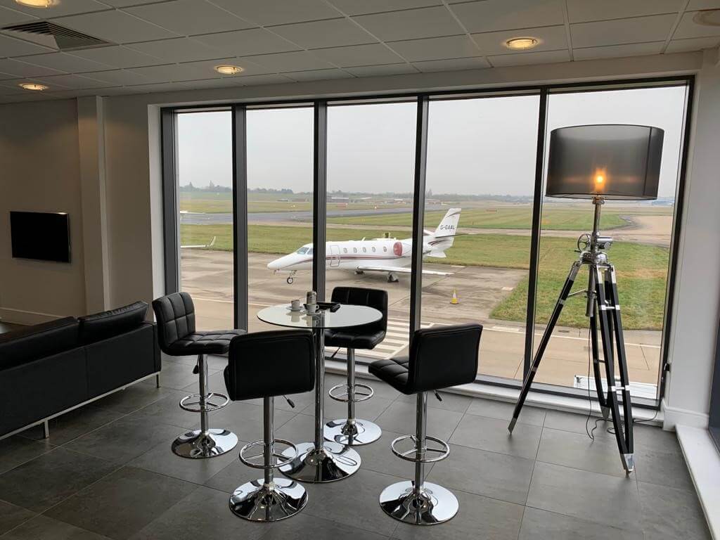 Passenger lobby at the airport with airplane view