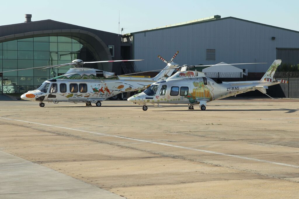 Two helicopters on the airport ramp