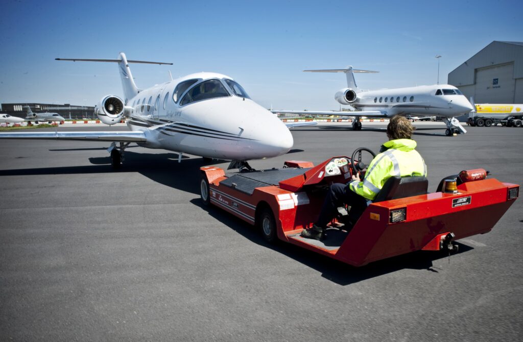 Man towing a plane