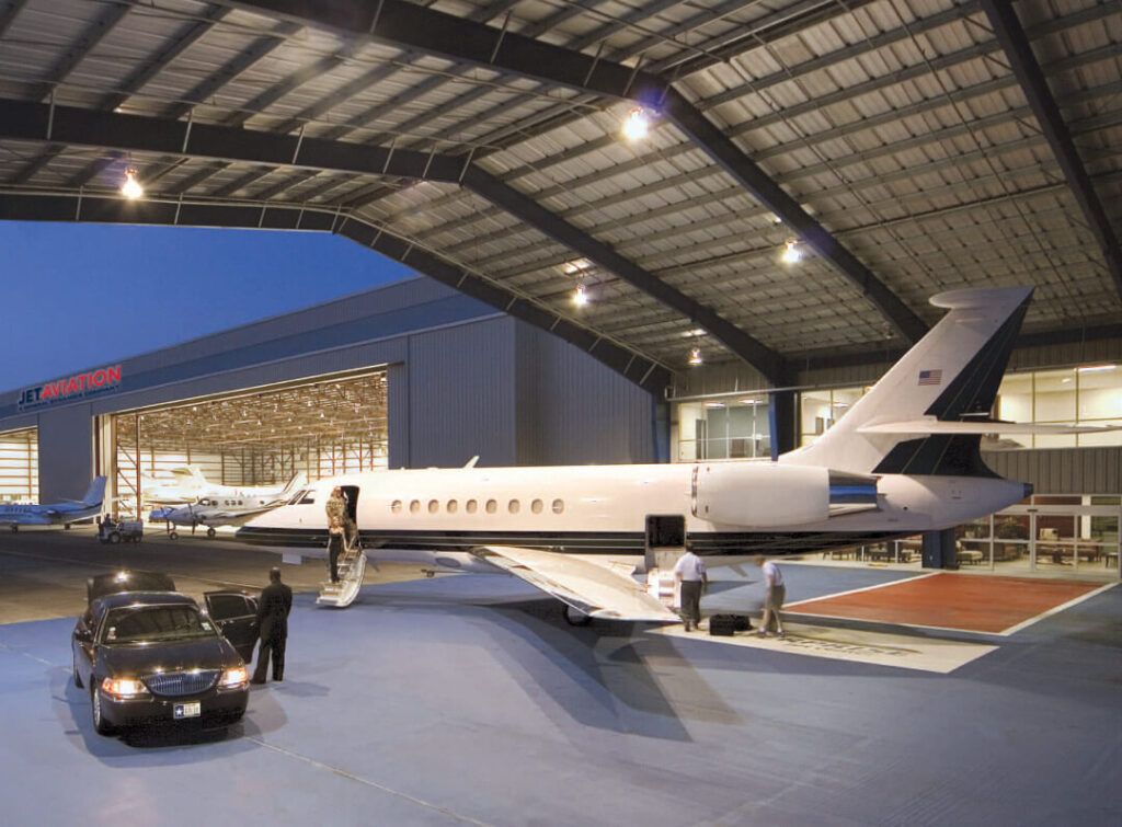 Plane and limousine in the hangar