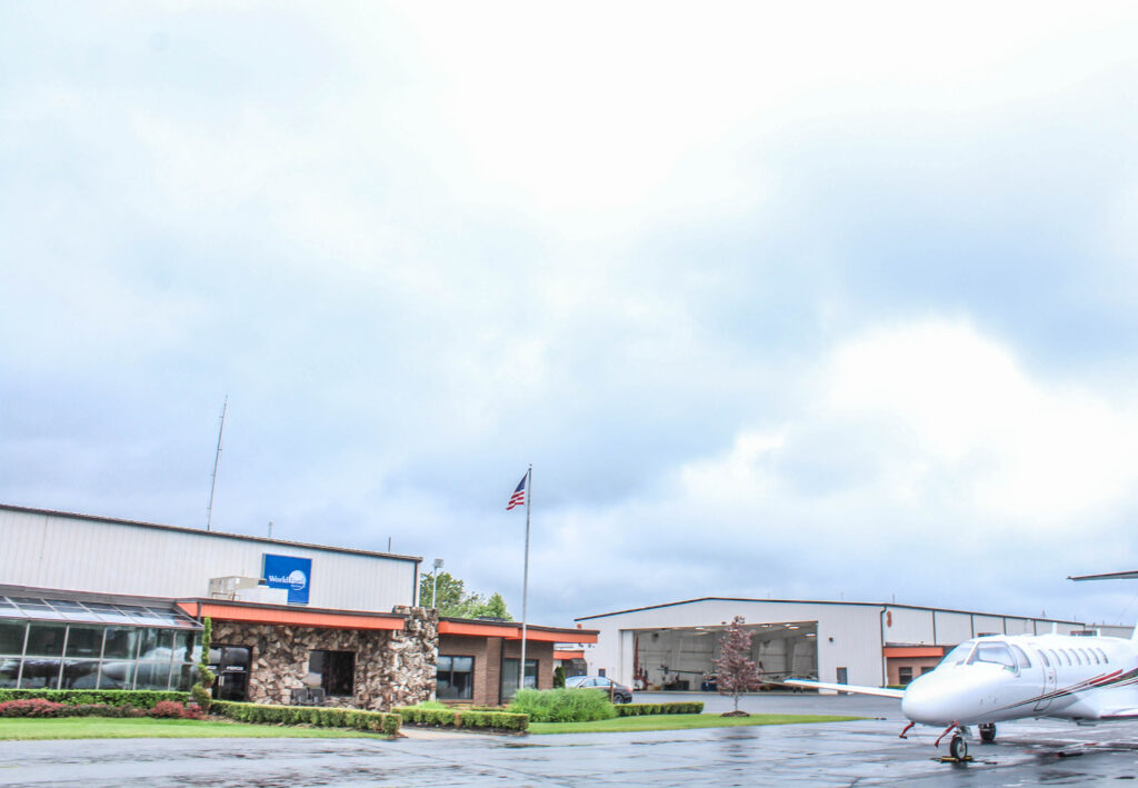 Plane passing by the airport building