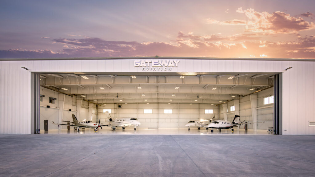 Airplanes in the hangar at sunset