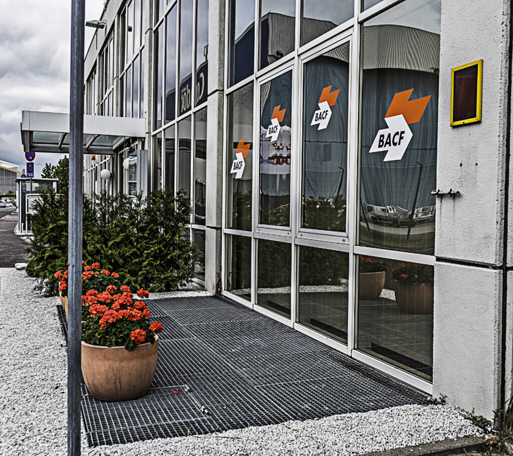 Pots with flowers placed in front of the entrance