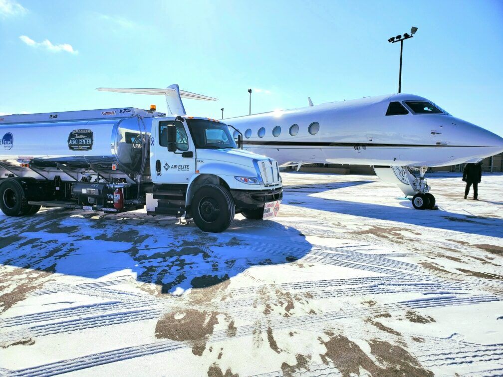 Truck and plane on the airport