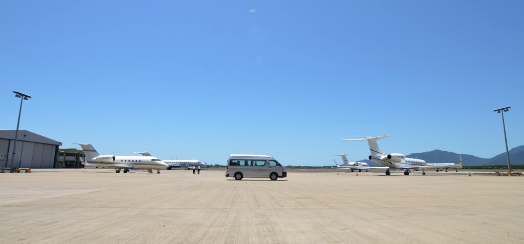 Van and aircraft on the background of the mountains