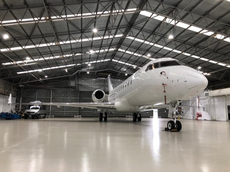 White plane in the hangar