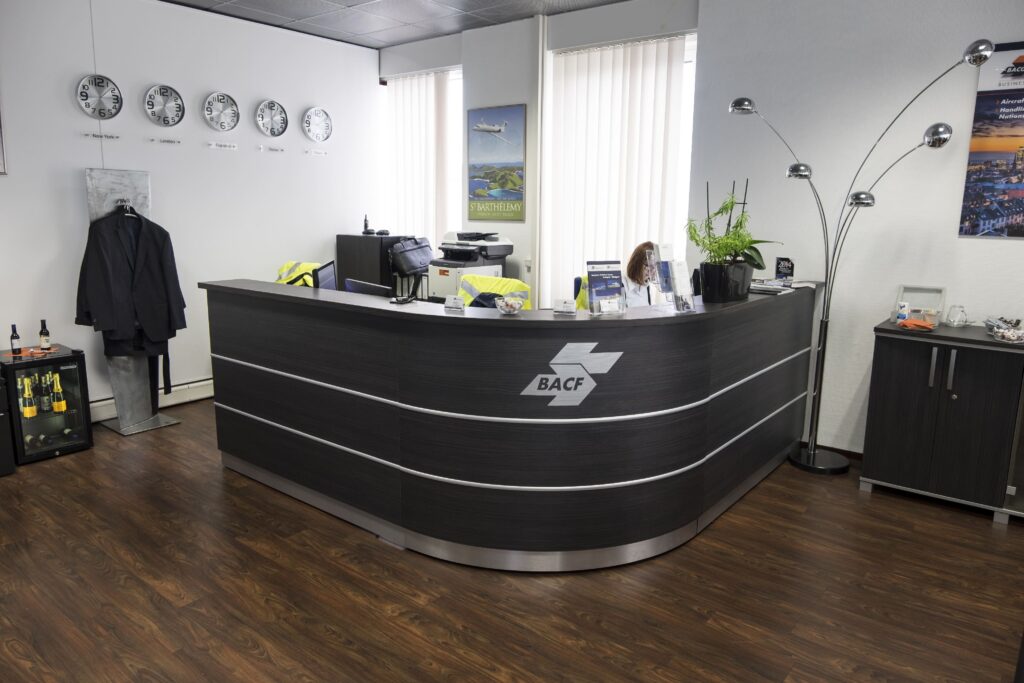 Reception front desk with clocks on the wall
