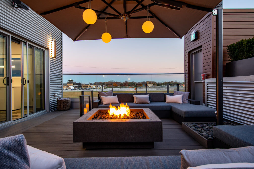 Artificial fireplace on the porch at sunset