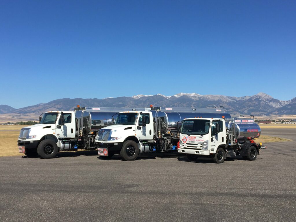 Three refuelers with mountainscape