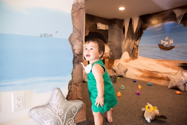 Young girl having fun in child room