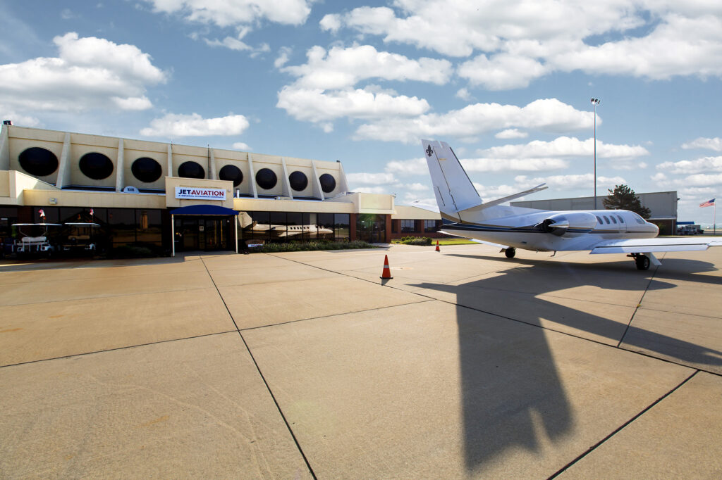 Back of the plan on the ramp next to the hangar building