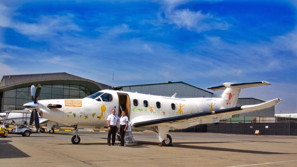 Two pilots and plane