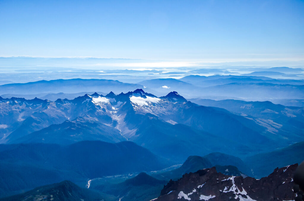 Aerial view of the snowy peaks of the mountains