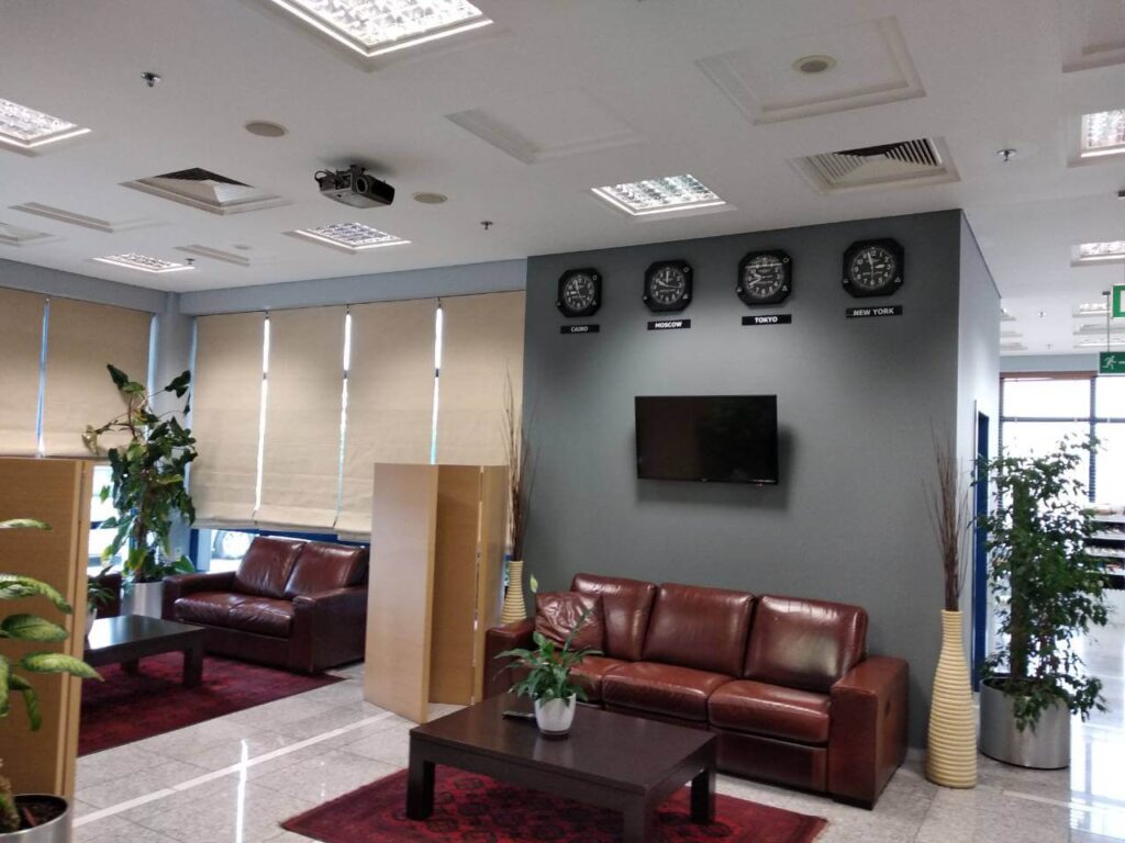 Waiting room with four clocks