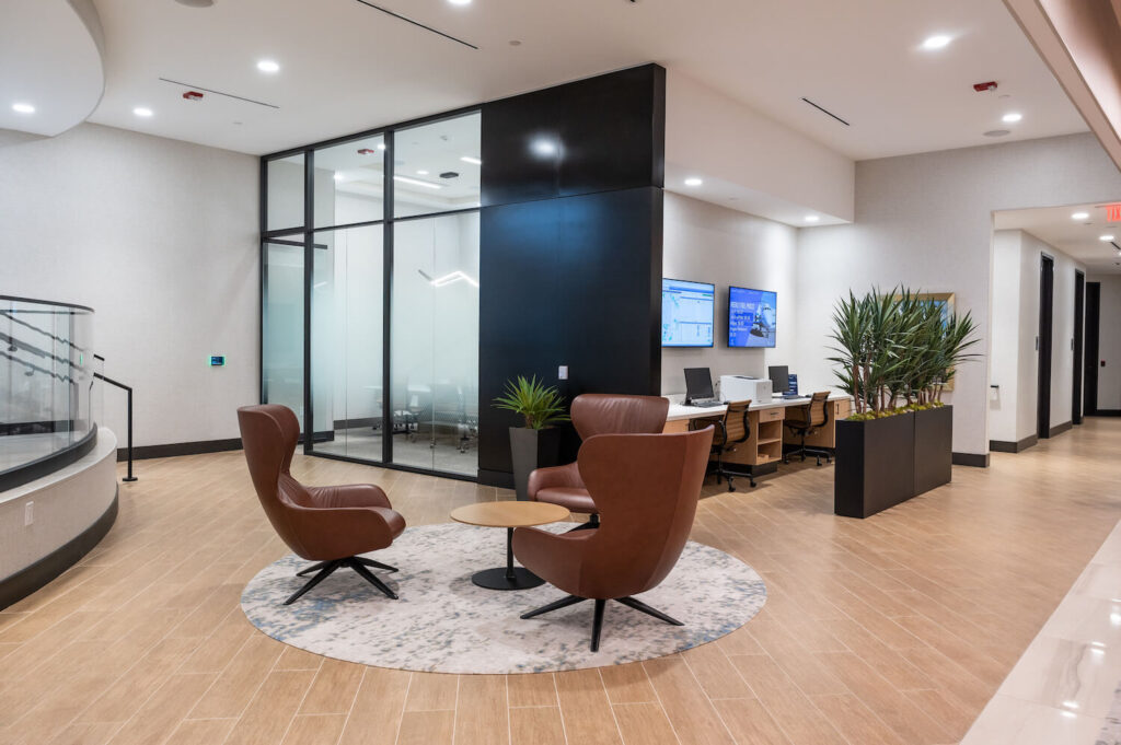 Interior with leather armchairs and desks with computers