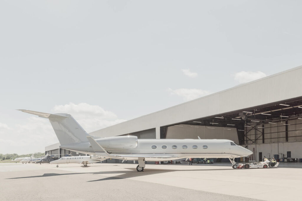 Hangar with aircraft and tug
