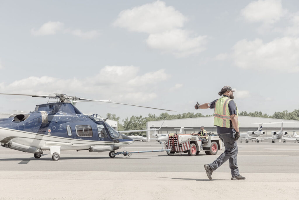 A man and a helicopter on the ramp