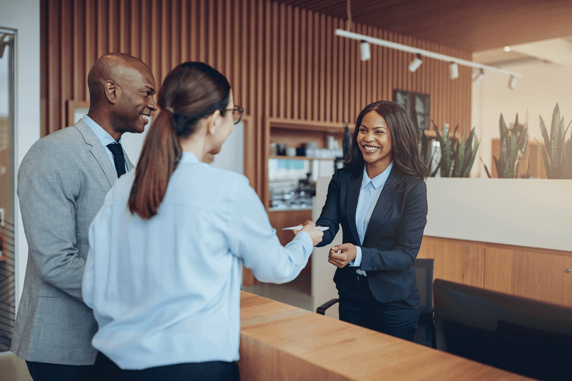 People at the reception desk on the airport lobby