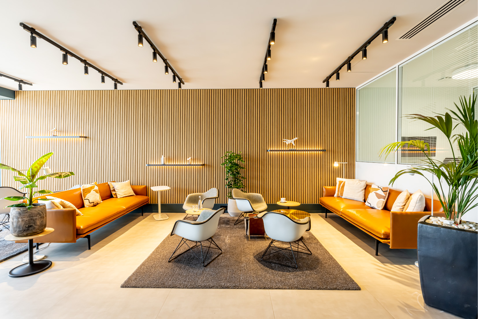 A lobby furnished with couches and chairs
