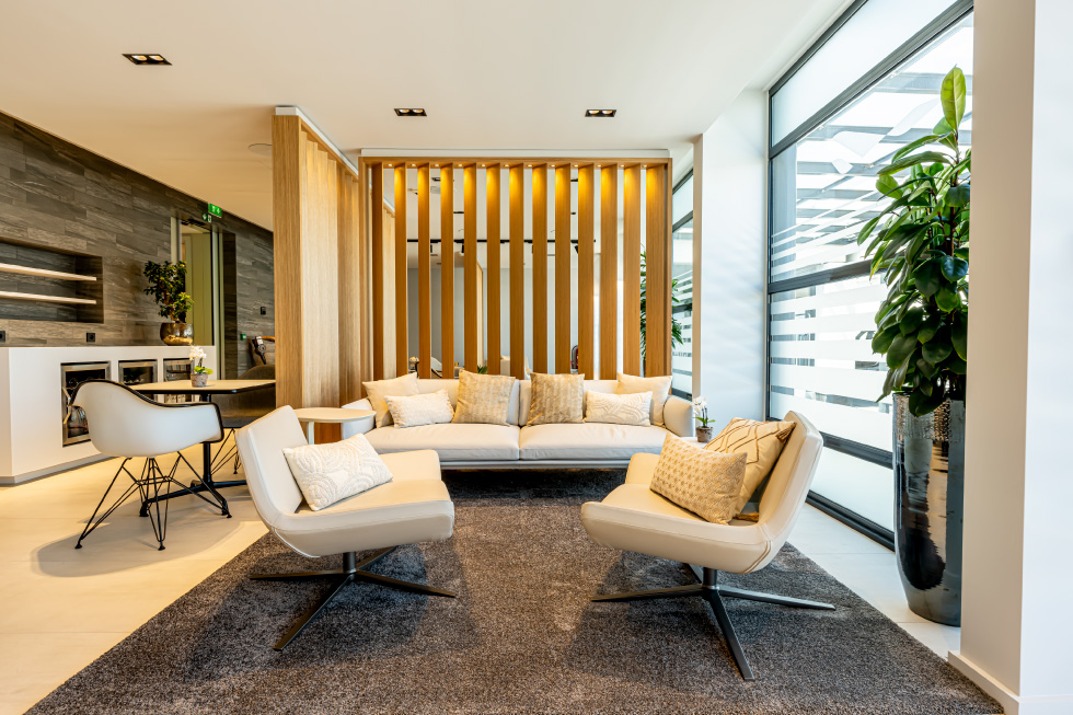 A lobby furnished with a couch and chairs