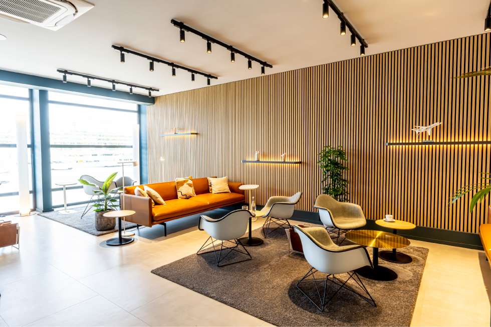 A lobby furnished with a couch and chairs