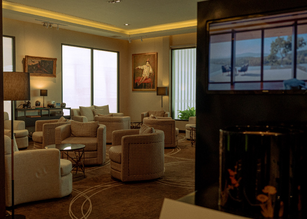 An MJets lounge furnished with chairs and art work